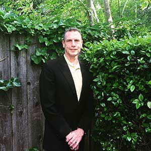 The image is a photo of John H. Hastings, DDS.